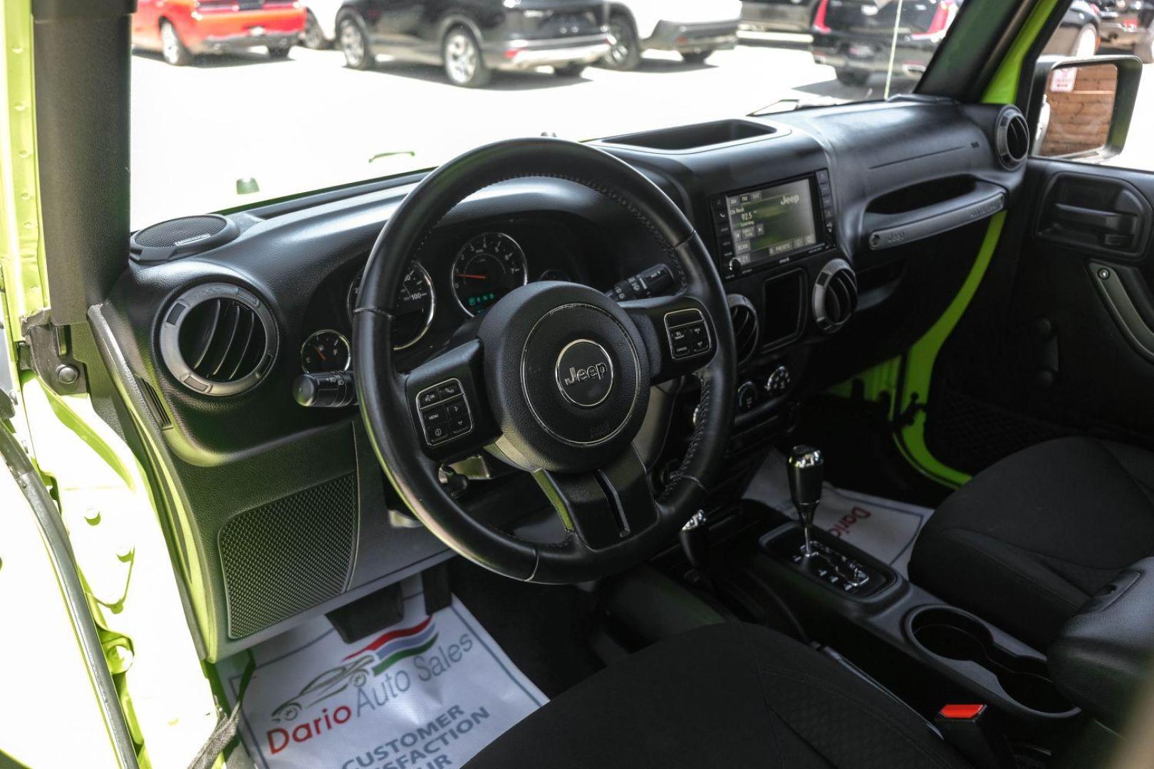 2017 green Jeep Wrangler Unlimited Sport 4WD (1C4BJWDG8HL) with an 3.6L V6 DOHC 24V FFV engine, located at 2401 E Main St., Grand Prairie, TX, 75050, (972) 262-4440, 32.748981, -96.969643 - Photo#12