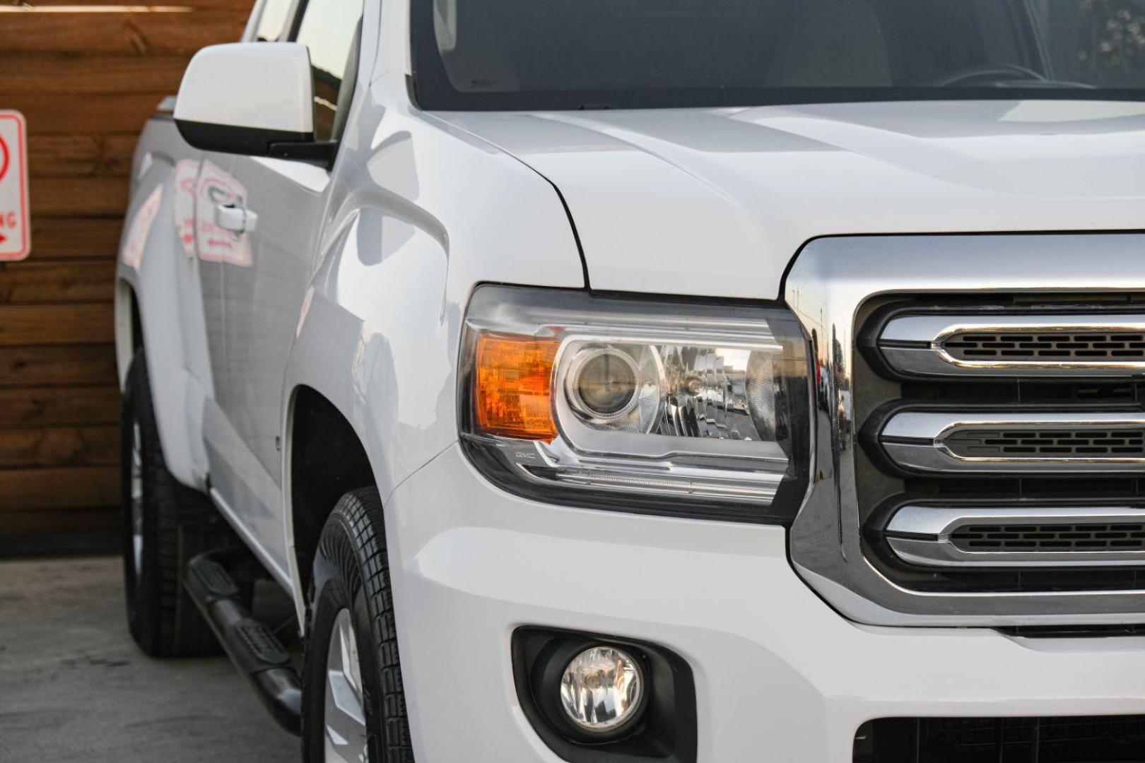 2015 WHITE GMC Canyon SLE Ext. Cab 2WD (1GTH5BEA3F1) with an 2.5L L4 DOHC 24V engine, 6-Speed Automatic transmission, located at 2401 E Main St., Grand Prairie, TX, 75050, (972) 262-4440, 32.748981, -96.969643 - Photo#41