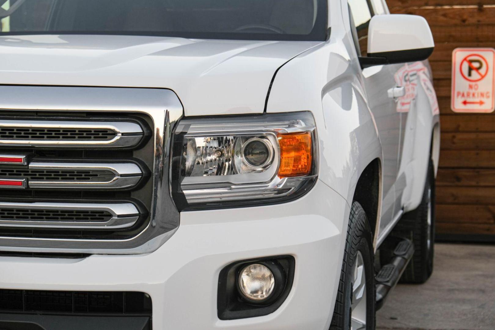 2015 WHITE GMC Canyon SLE Ext. Cab 2WD (1GTH5BEA3F1) with an 2.5L L4 DOHC 24V engine, 6-Speed Automatic transmission, located at 2401 E Main St., Grand Prairie, TX, 75050, (972) 262-4440, 32.748981, -96.969643 - Photo#42