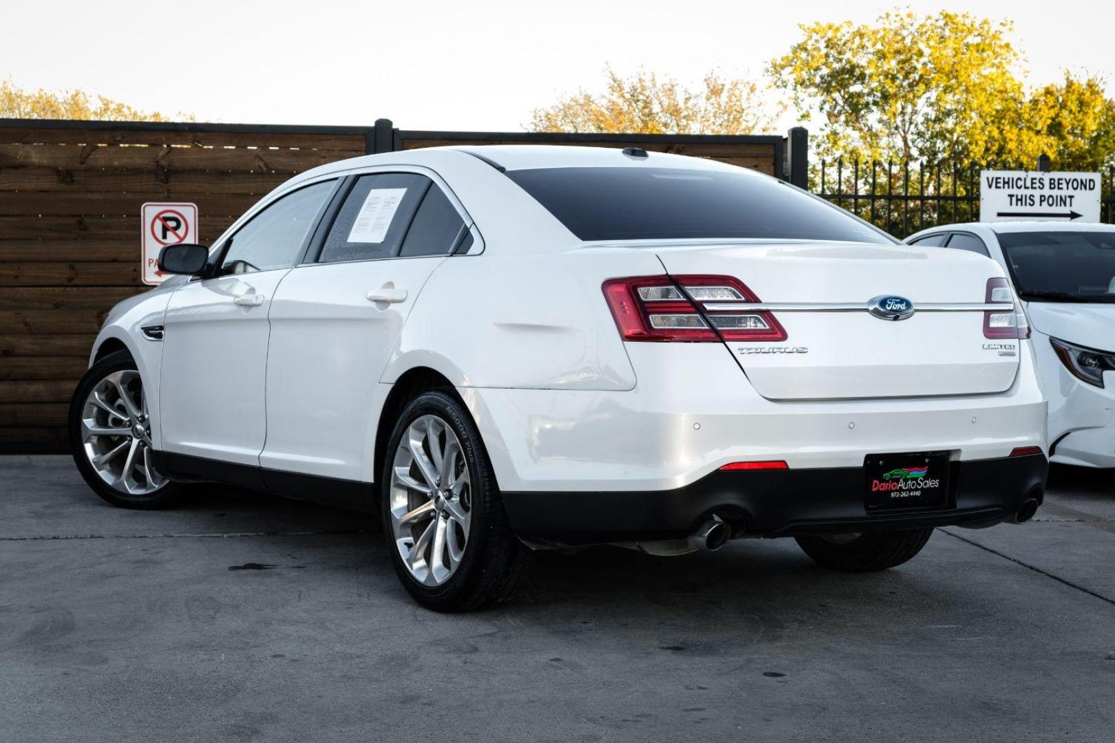 2013 WHITE Ford Taurus Limited FWD (1FAHP2F97DG) with an 2.0L L4 DOHC 16V engine, 6-Speed Automatic transmission, located at 2401 E Main St., Grand Prairie, TX, 75050, (972) 262-4440, 32.748981, -96.969643 - Photo#7