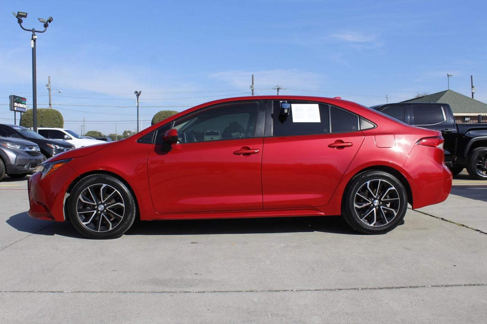 2021 RED Toyota Corolla LE (JTDEPMAE6MJ) with an 1.8L L4 DOHC 16V engine, Continuously Variabl transmission, located at 2401 E Main St., Grand Prairie, TX, 75050, (972) 262-4440, 32.748981, -96.969643 - Photo#2