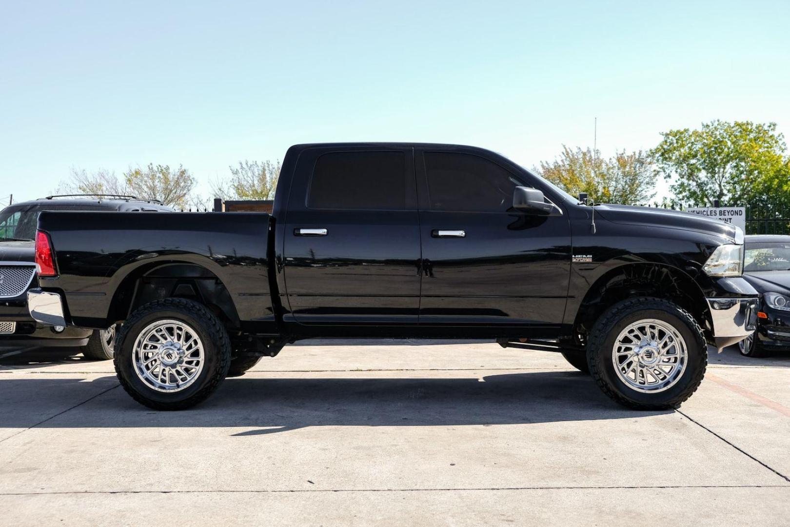 2014 BLACK RAM 1500 SLT Crew Cab SWB 4WD (1C6RR7LT0ES) with an 5.7L V8 OHV 16V engine, 8-Speed Automatic transmission, located at 2401 E Main St., Grand Prairie, TX, 75050, (972) 262-4440, 32.748981, -96.969643 - Photo#4