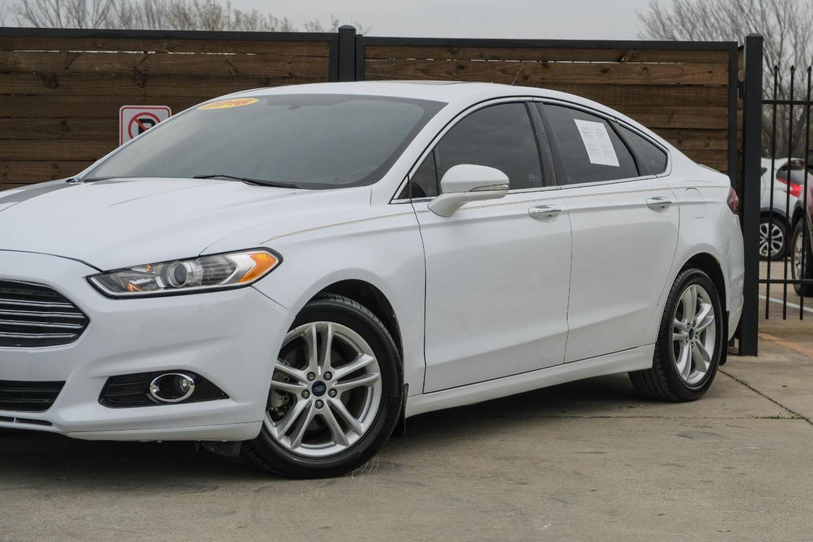 2016 white Ford Fusion Titanium AWD (3FA6P0D98GR) with an 2.0L L4 DOHC 16V engine, 6-Speed Automatic transmission, located at 2401 E Main St., Grand Prairie, TX, 75050, (972) 262-4440, 32.748981, -96.969643 - Photo#10