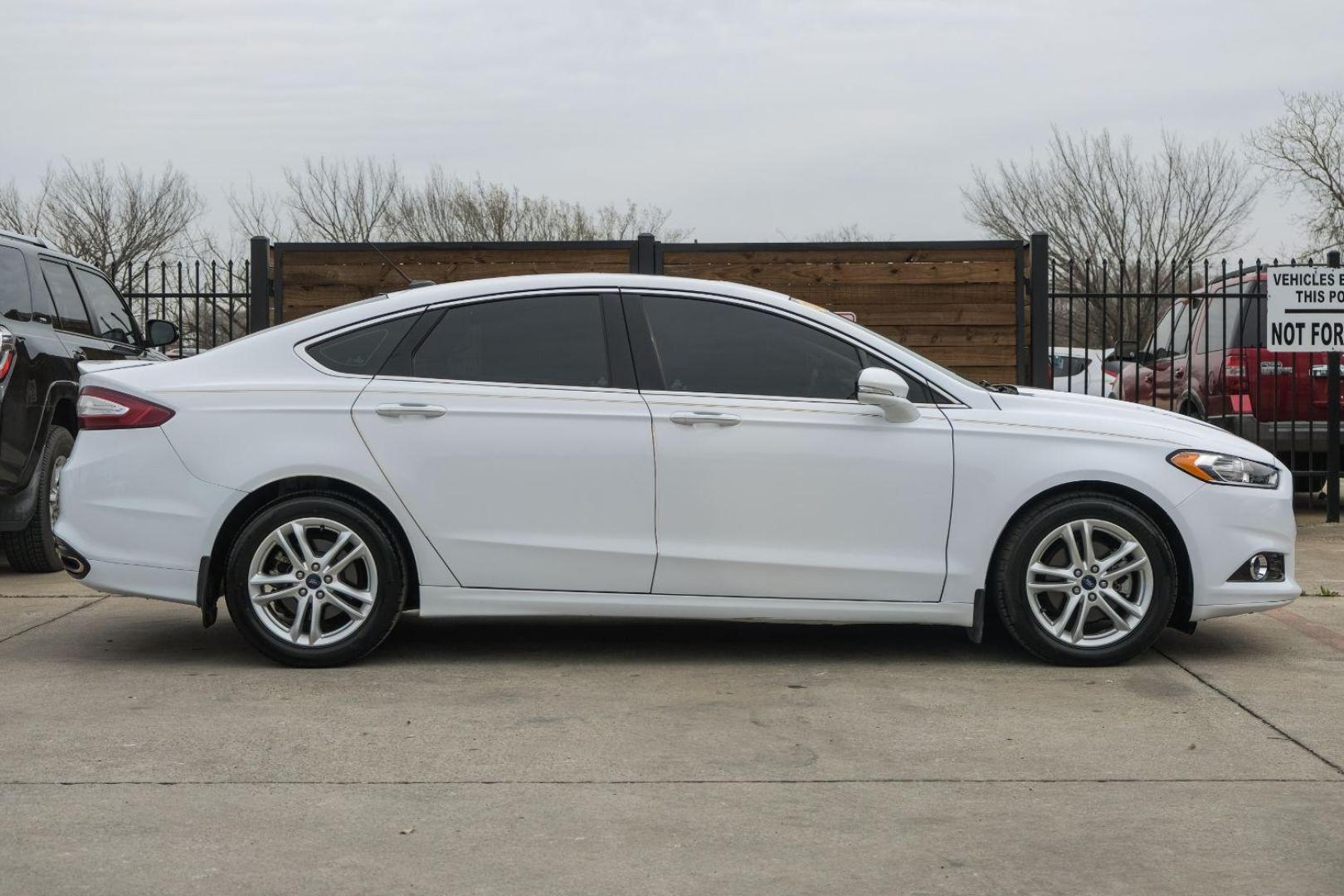 2016 white Ford Fusion Titanium AWD (3FA6P0D98GR) with an 2.0L L4 DOHC 16V engine, 6-Speed Automatic transmission, located at 2401 E Main St., Grand Prairie, TX, 75050, (972) 262-4440, 32.748981, -96.969643 - Photo#11