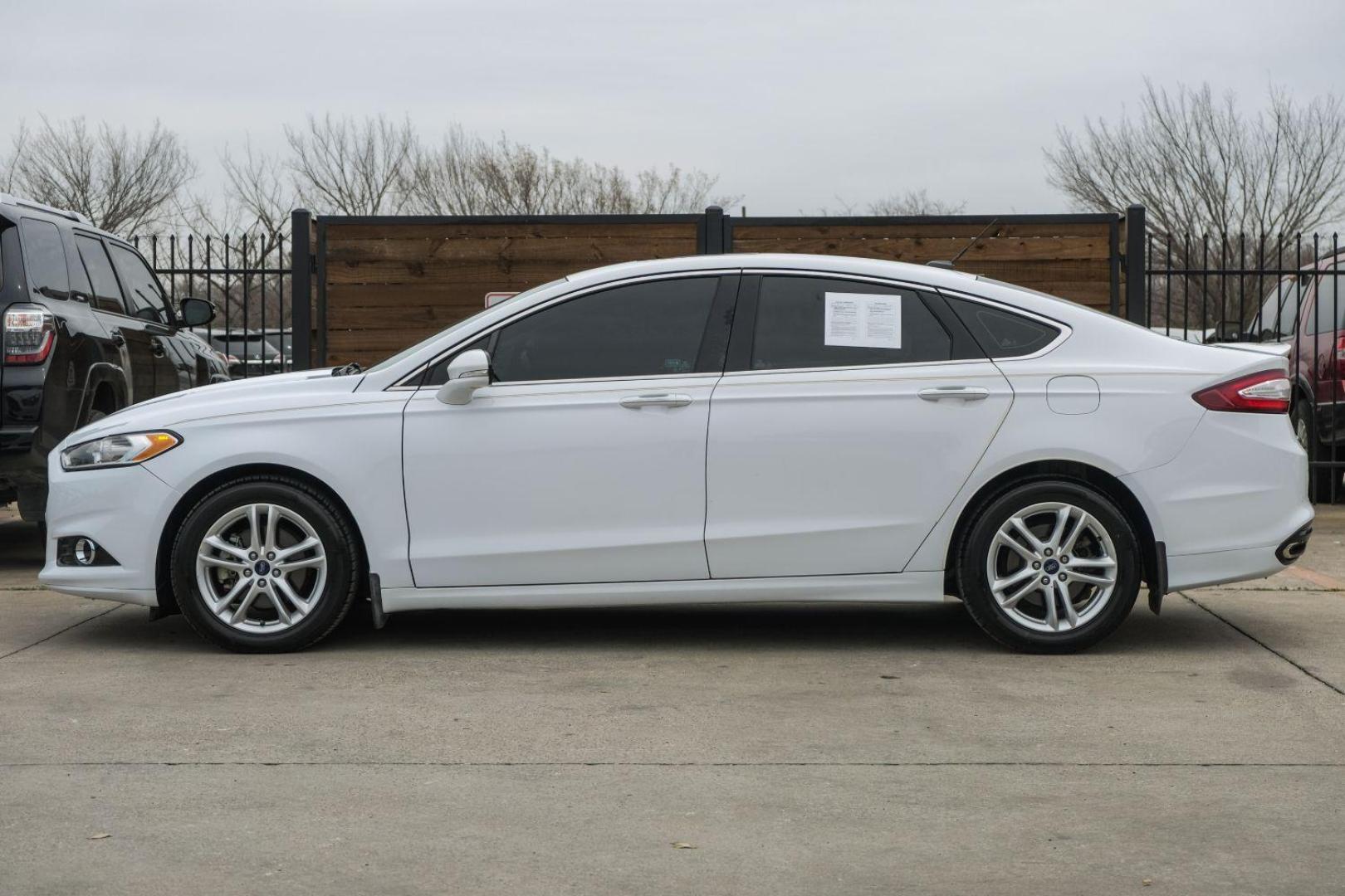 2016 white Ford Fusion Titanium AWD (3FA6P0D98GR) with an 2.0L L4 DOHC 16V engine, 6-Speed Automatic transmission, located at 2401 E Main St., Grand Prairie, TX, 75050, (972) 262-4440, 32.748981, -96.969643 - Photo#15