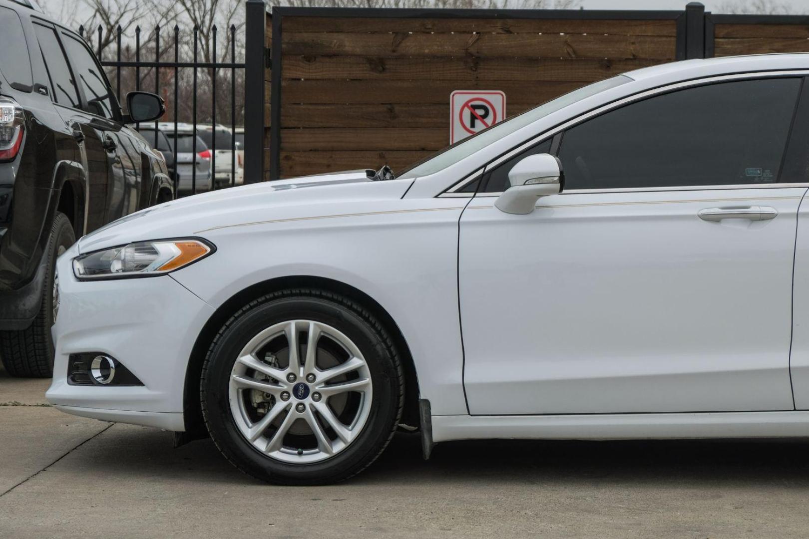 2016 white Ford Fusion Titanium AWD (3FA6P0D98GR) with an 2.0L L4 DOHC 16V engine, 6-Speed Automatic transmission, located at 2401 E Main St., Grand Prairie, TX, 75050, (972) 262-4440, 32.748981, -96.969643 - Photo#16