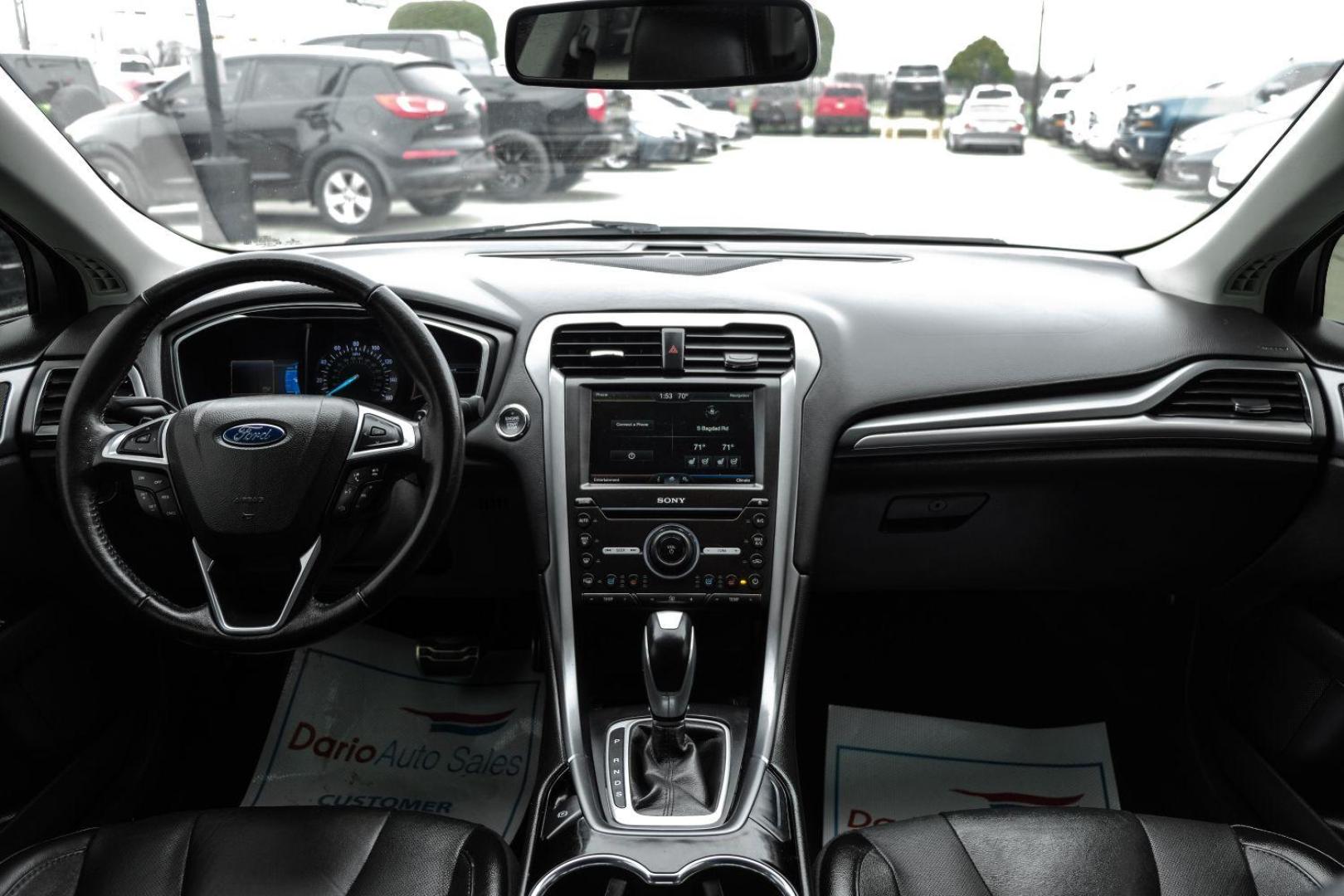 2016 white Ford Fusion Titanium AWD (3FA6P0D98GR) with an 2.0L L4 DOHC 16V engine, 6-Speed Automatic transmission, located at 2401 E Main St., Grand Prairie, TX, 75050, (972) 262-4440, 32.748981, -96.969643 - Photo#19