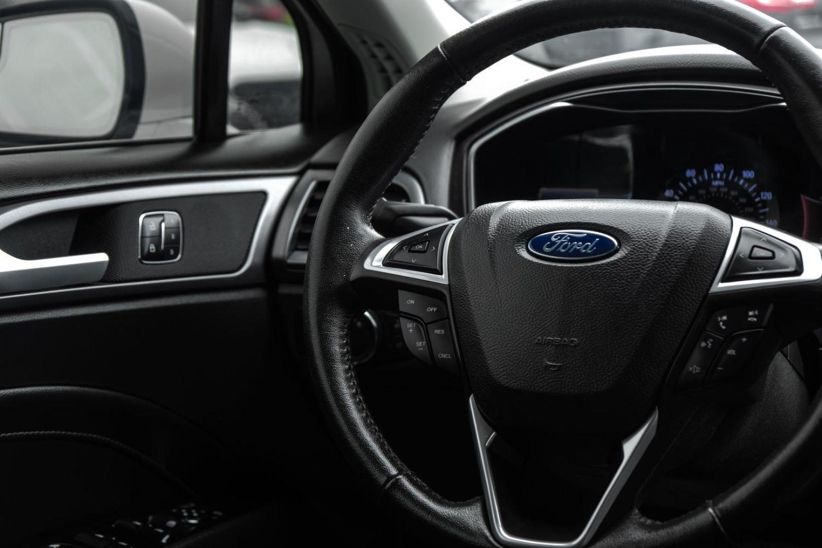 2016 white Ford Fusion Titanium AWD (3FA6P0D98GR) with an 2.0L L4 DOHC 16V engine, 6-Speed Automatic transmission, located at 2401 E Main St., Grand Prairie, TX, 75050, (972) 262-4440, 32.748981, -96.969643 - Photo#22