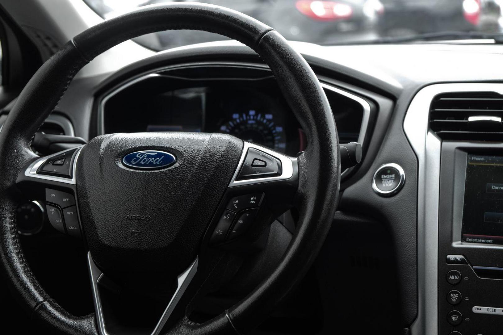 2016 white Ford Fusion Titanium AWD (3FA6P0D98GR) with an 2.0L L4 DOHC 16V engine, 6-Speed Automatic transmission, located at 2401 E Main St., Grand Prairie, TX, 75050, (972) 262-4440, 32.748981, -96.969643 - Photo#23