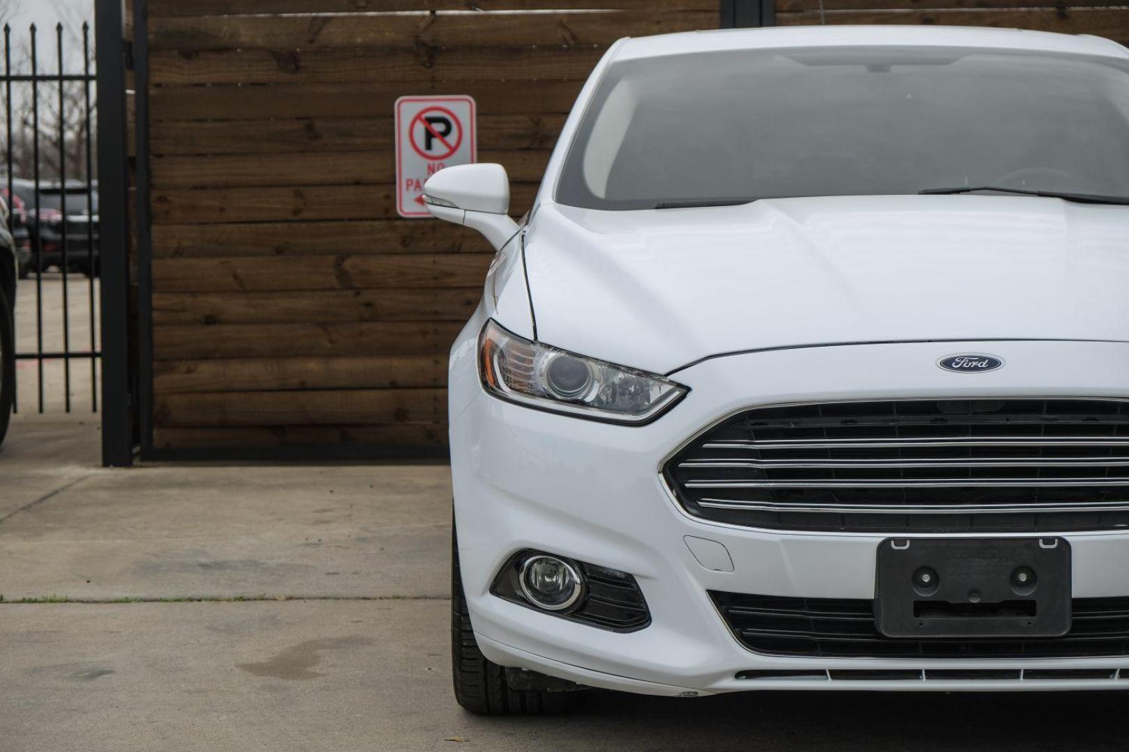 2016 white Ford Fusion Titanium AWD (3FA6P0D98GR) with an 2.0L L4 DOHC 16V engine, 6-Speed Automatic transmission, located at 2401 E Main St., Grand Prairie, TX, 75050, (972) 262-4440, 32.748981, -96.969643 - Photo#50