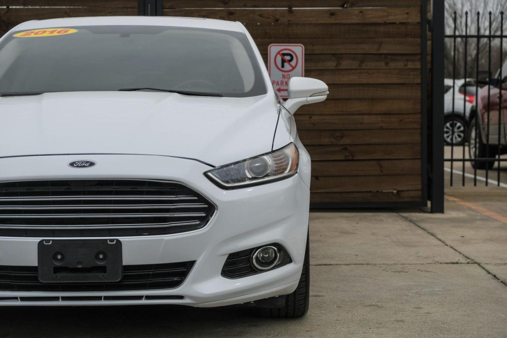 2016 white Ford Fusion Titanium AWD (3FA6P0D98GR) with an 2.0L L4 DOHC 16V engine, 6-Speed Automatic transmission, located at 2401 E Main St., Grand Prairie, TX, 75050, (972) 262-4440, 32.748981, -96.969643 - Photo#51