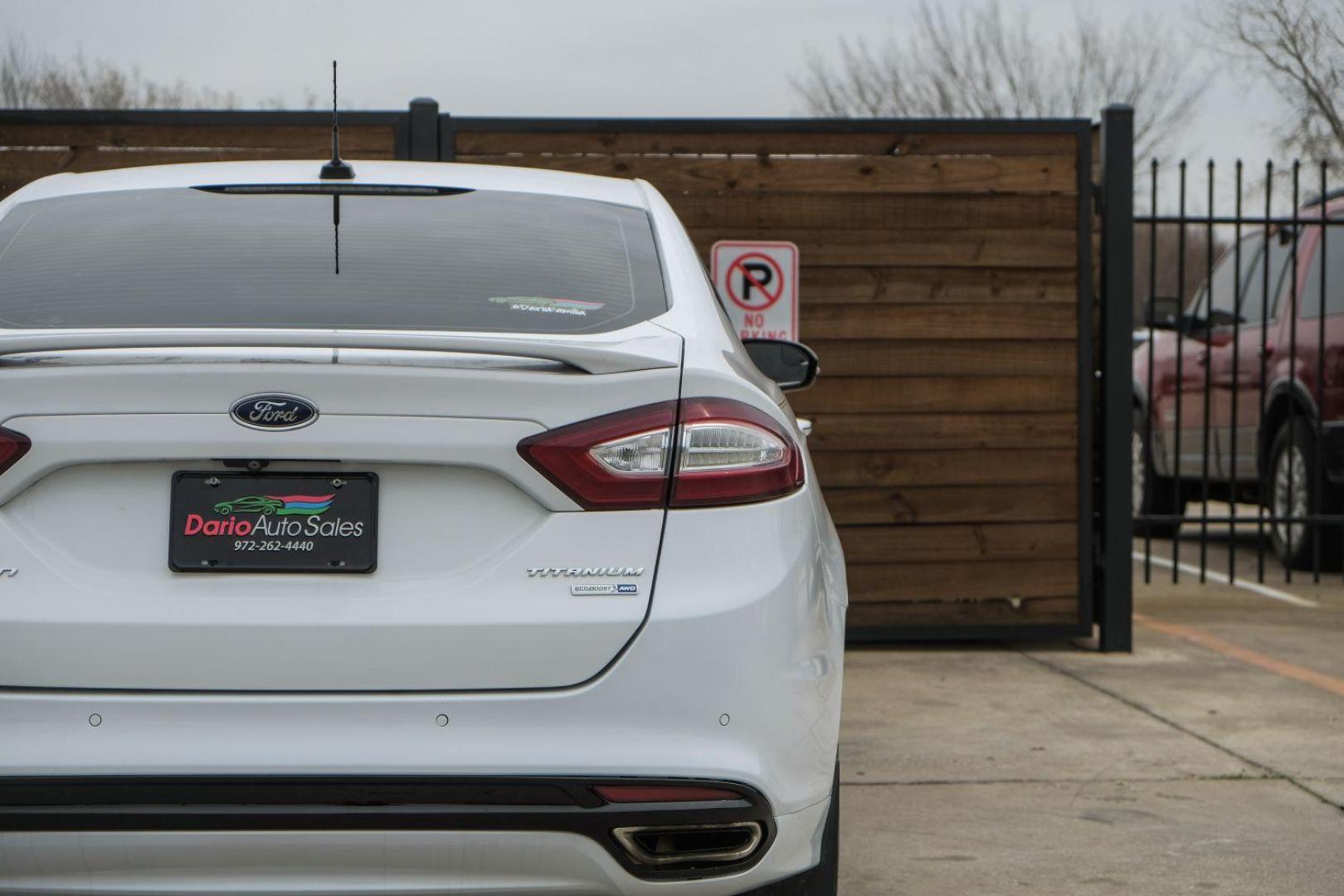 2016 white Ford Fusion Titanium AWD (3FA6P0D98GR) with an 2.0L L4 DOHC 16V engine, 6-Speed Automatic transmission, located at 2401 E Main St., Grand Prairie, TX, 75050, (972) 262-4440, 32.748981, -96.969643 - Photo#53