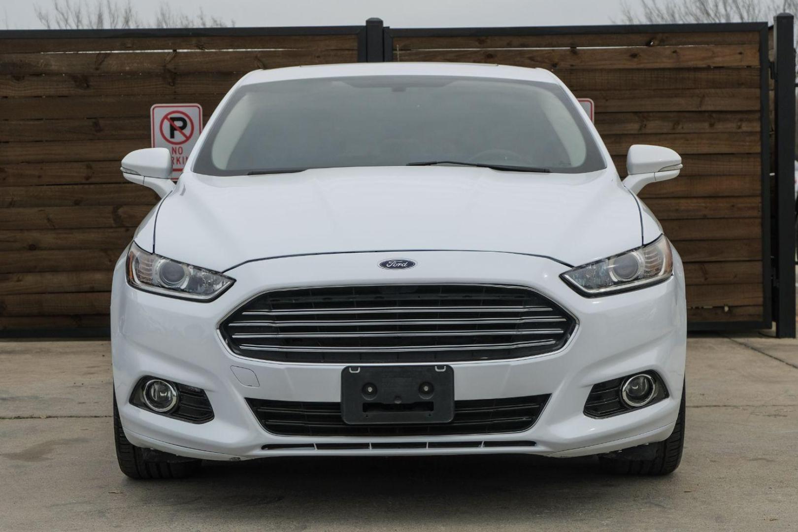 2016 white Ford Fusion Titanium AWD (3FA6P0D98GR) with an 2.0L L4 DOHC 16V engine, 6-Speed Automatic transmission, located at 2401 E Main St., Grand Prairie, TX, 75050, (972) 262-4440, 32.748981, -96.969643 - Photo#5