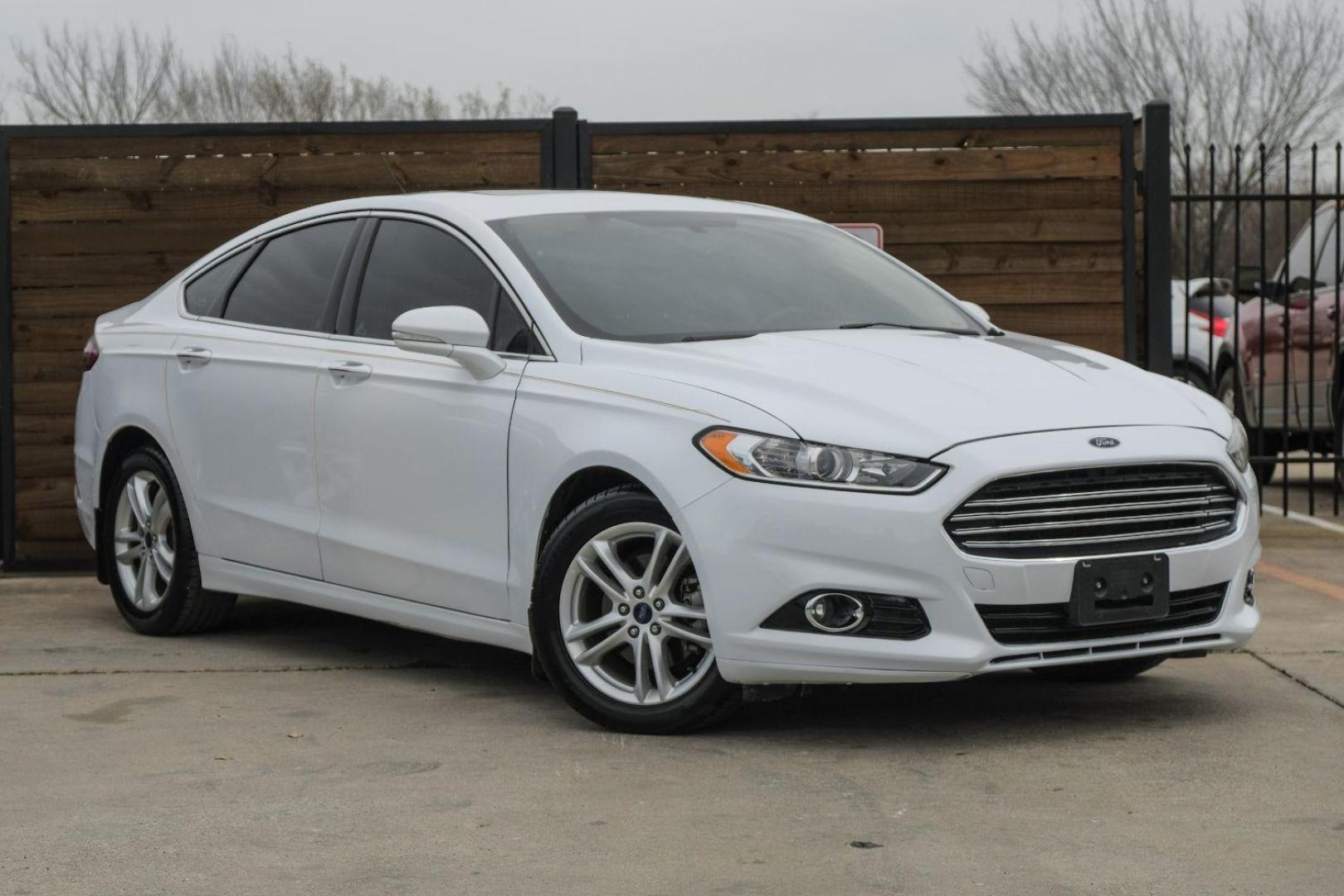 2016 white Ford Fusion Titanium AWD (3FA6P0D98GR) with an 2.0L L4 DOHC 16V engine, 6-Speed Automatic transmission, located at 2401 E Main St., Grand Prairie, TX, 75050, (972) 262-4440, 32.748981, -96.969643 - Photo#6