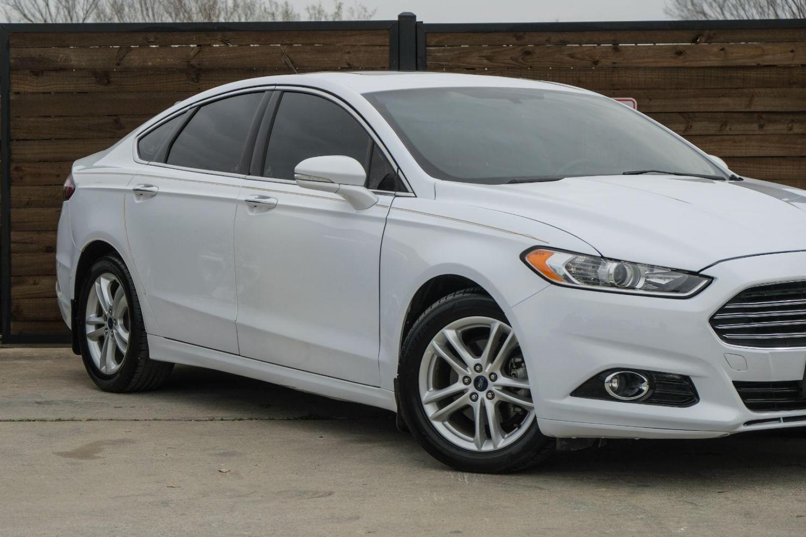 2016 white Ford Fusion Titanium AWD (3FA6P0D98GR) with an 2.0L L4 DOHC 16V engine, 6-Speed Automatic transmission, located at 2401 E Main St., Grand Prairie, TX, 75050, (972) 262-4440, 32.748981, -96.969643 - Photo#7