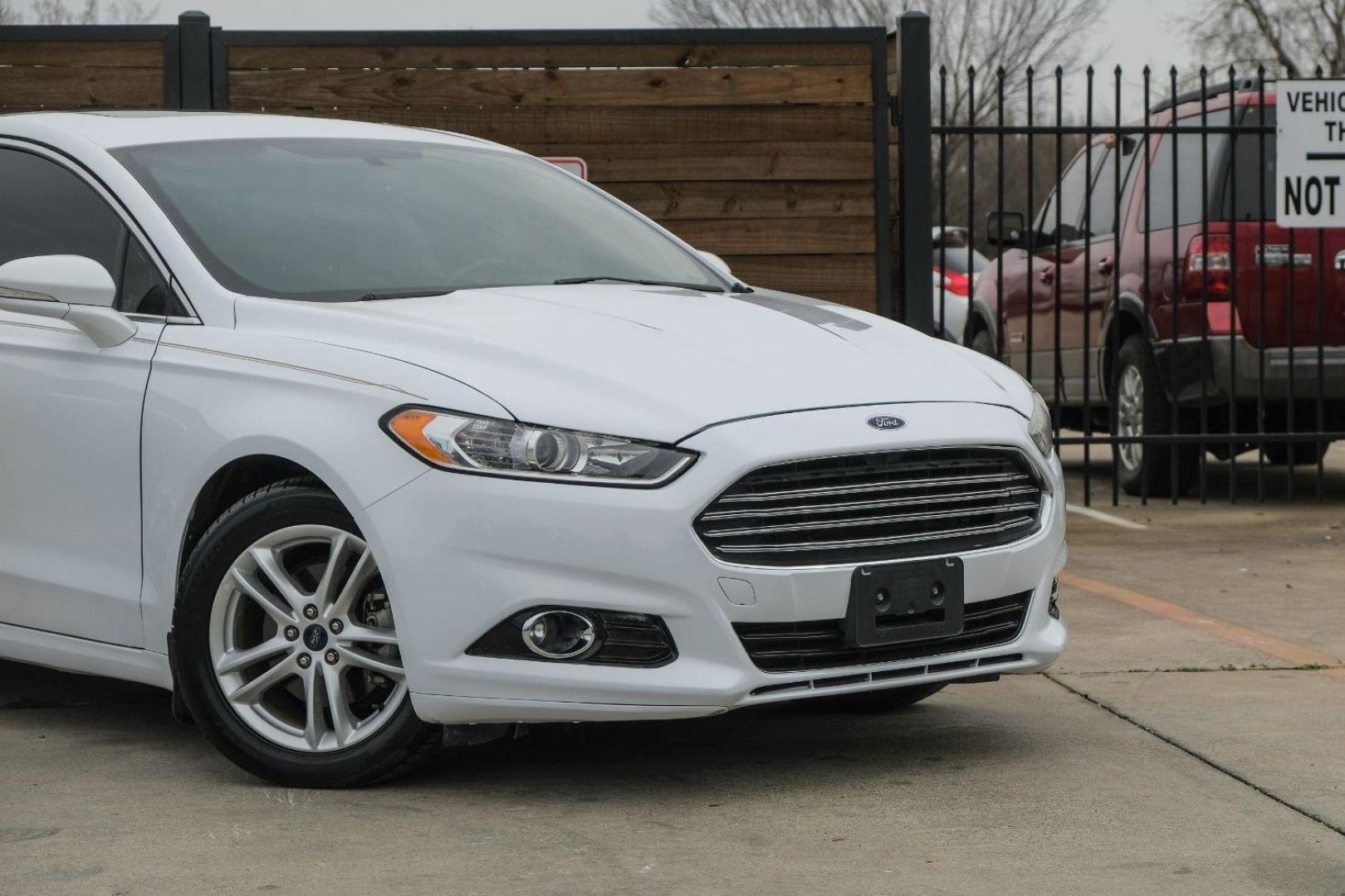 2016 white Ford Fusion Titanium AWD (3FA6P0D98GR) with an 2.0L L4 DOHC 16V engine, 6-Speed Automatic transmission, located at 2401 E Main St., Grand Prairie, TX, 75050, (972) 262-4440, 32.748981, -96.969643 - Photo#8