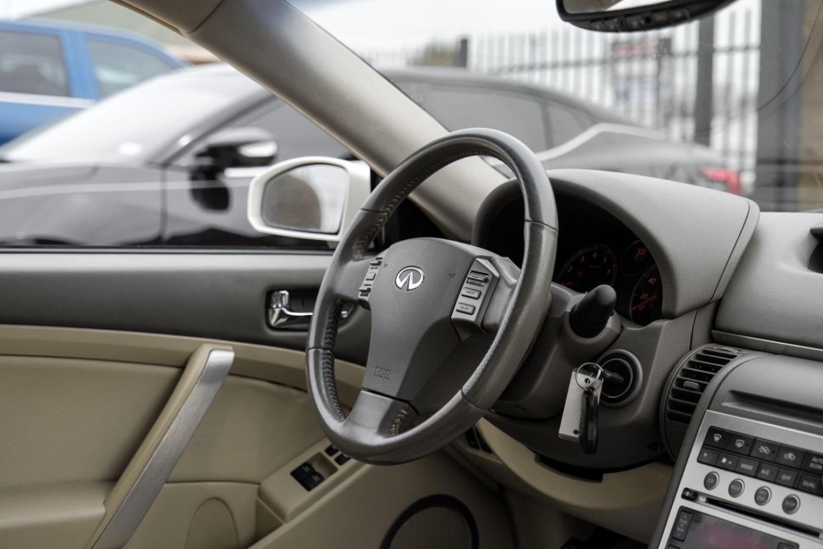 2005 WHITE Infiniti G35 Coupe (JNKCV54E55M) with an 3.5L V6 DOHC 24V engine, 5-Speed Automatic transmission, located at 2401 E Main St., Grand Prairie, TX, 75050, (972) 262-4440, 32.748981, -96.969643 - Photo#19