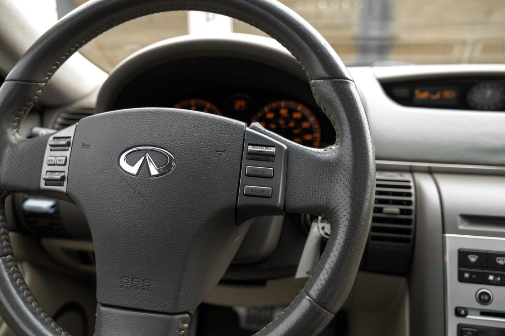 2005 WHITE Infiniti G35 Coupe (JNKCV54E55M) with an 3.5L V6 DOHC 24V engine, 5-Speed Automatic transmission, located at 2401 E Main St., Grand Prairie, TX, 75050, (972) 262-4440, 32.748981, -96.969643 - Photo#22