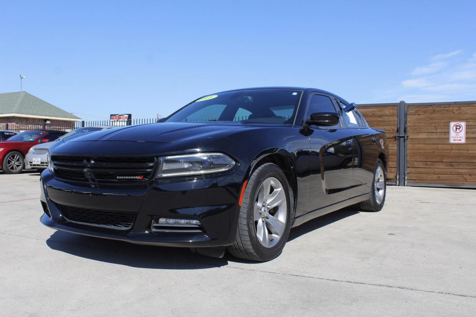 2016 BLACK Dodge Charger SXT (2C3CDXHG8GH) with an 3.6L V6 DOHC 24V engine, 8-Speed Automatic transmission, located at 2401 E Main St., Grand Prairie, TX, 75050, (972) 262-4440, 32.748981, -96.969643 - Photo#1