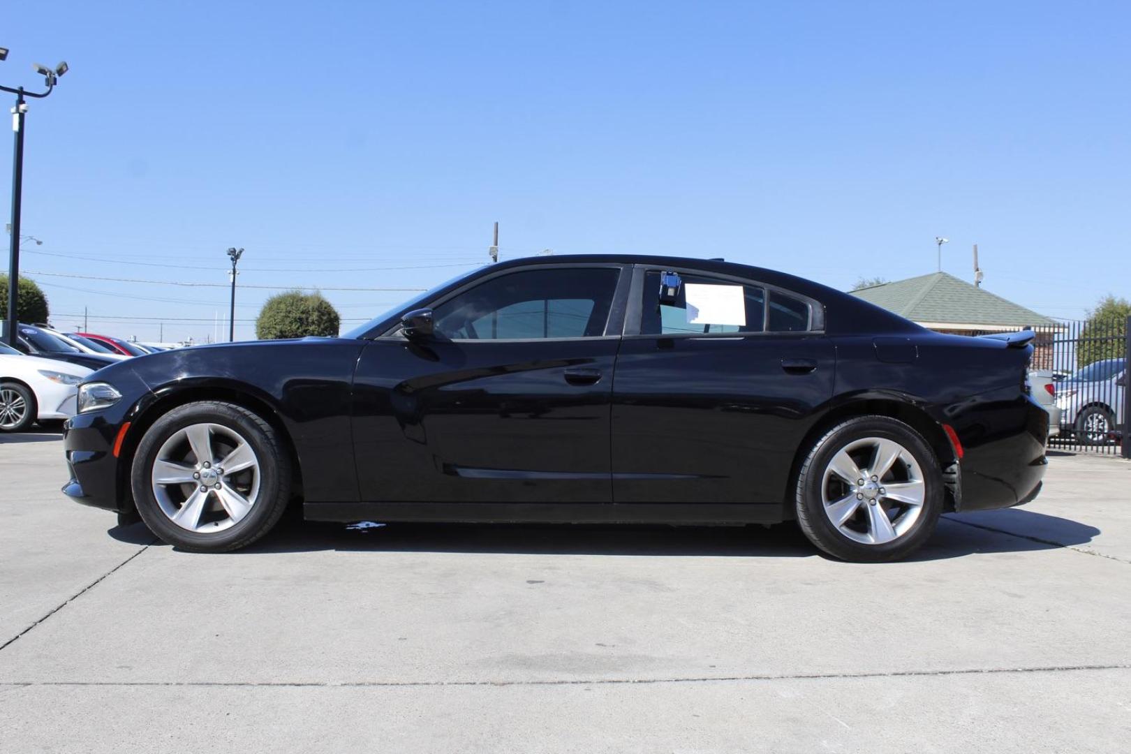 2016 BLACK Dodge Charger SXT (2C3CDXHG8GH) with an 3.6L V6 DOHC 24V engine, 8-Speed Automatic transmission, located at 2401 E Main St., Grand Prairie, TX, 75050, (972) 262-4440, 32.748981, -96.969643 - Photo#2