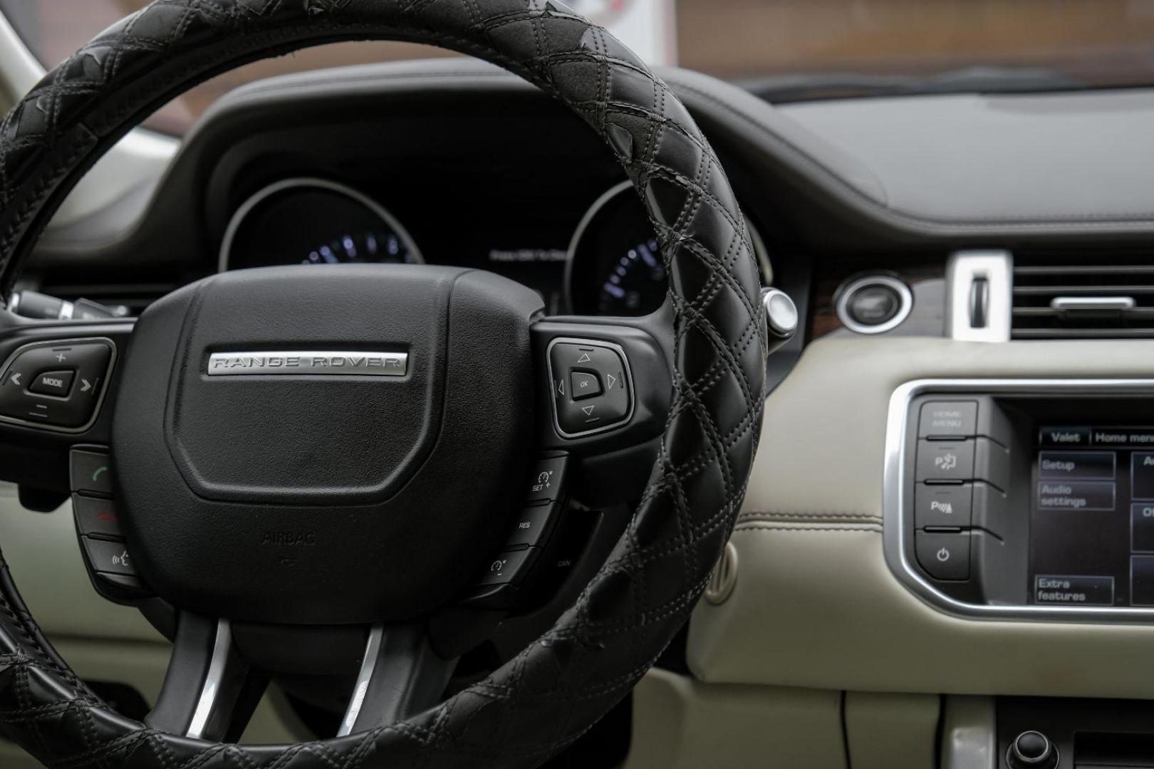 2015 black Land Rover Range Rover Evoque Prestige Premium 5-Door (SALVV2BG8FH) with an 2.0L L4 DOHC 24V TURBO engine, 9-Speed Automatic transmission, located at 2401 E Main St., Grand Prairie, TX, 75050, (972) 262-4440, 32.748981, -96.969643 - Photo#23