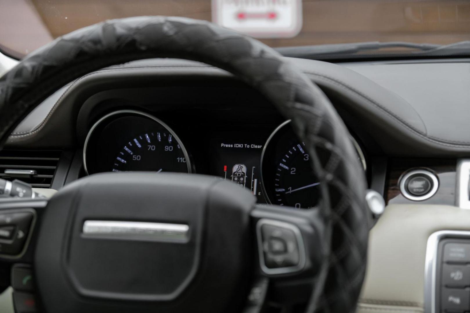 2015 black Land Rover Range Rover Evoque Prestige Premium 5-Door (SALVV2BG8FH) with an 2.0L L4 DOHC 24V TURBO engine, 9-Speed Automatic transmission, located at 2401 E Main St., Grand Prairie, TX, 75050, (972) 262-4440, 32.748981, -96.969643 - Photo#24