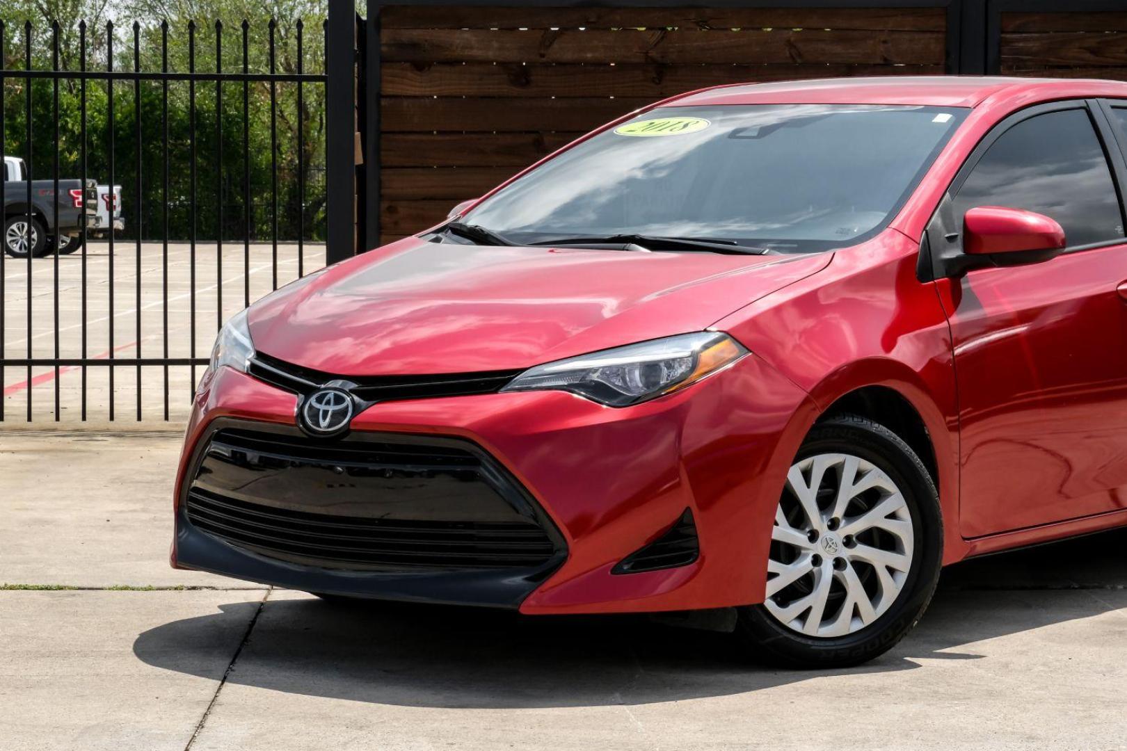 2018 red Toyota Corolla LE CVT (5YFBURHE8JP) with an 1.8L L4 DOHC 16V engine, Continuously Variable Transmission transmission, located at 2401 E Main St., Grand Prairie, TX, 75050, (972) 262-4440, 32.748981, -96.969643 - Photo#4