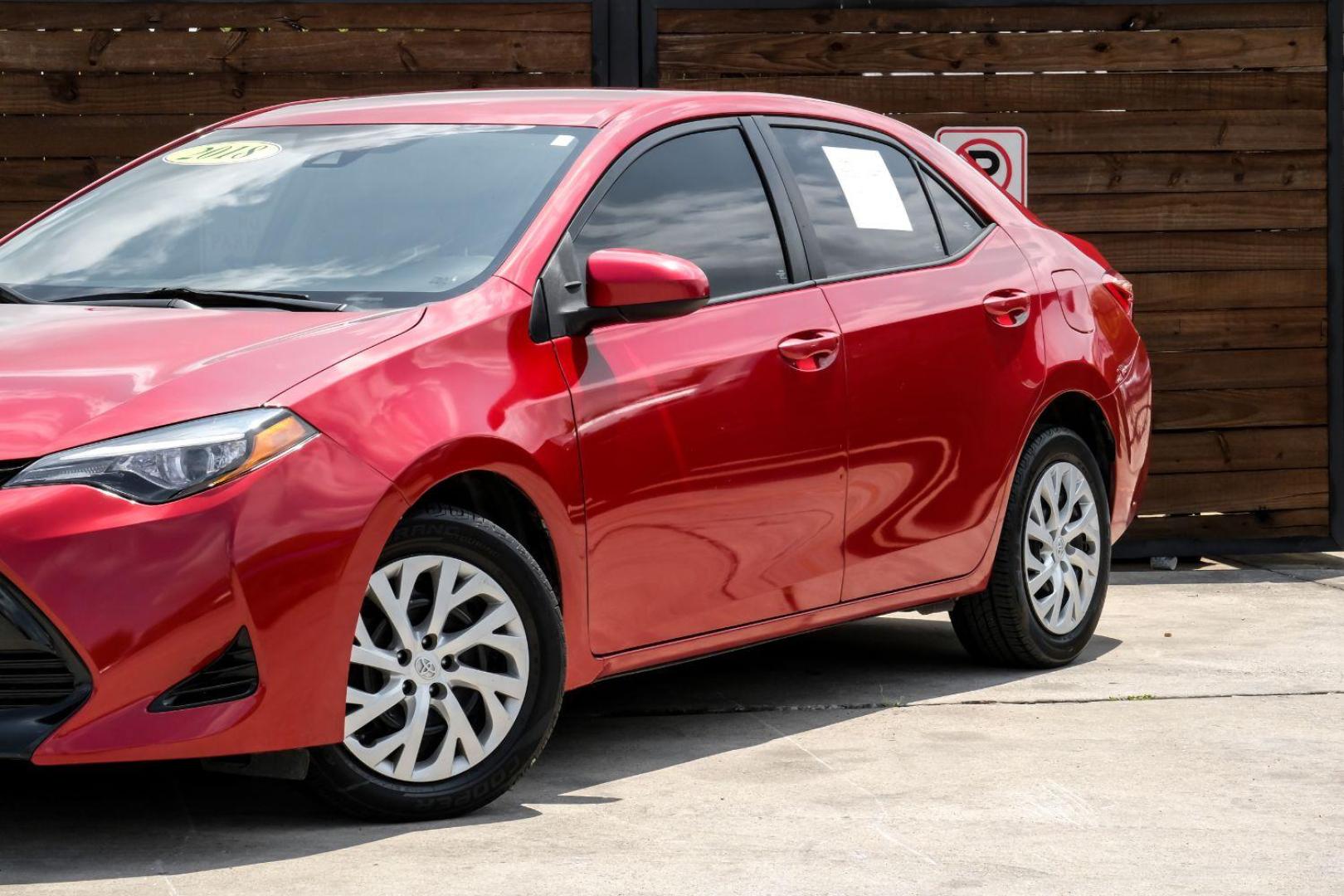 2018 red Toyota Corolla LE CVT (5YFBURHE8JP) with an 1.8L L4 DOHC 16V engine, Continuously Variable Transmission transmission, located at 2401 E Main St., Grand Prairie, TX, 75050, (972) 262-4440, 32.748981, -96.969643 - Photo#5