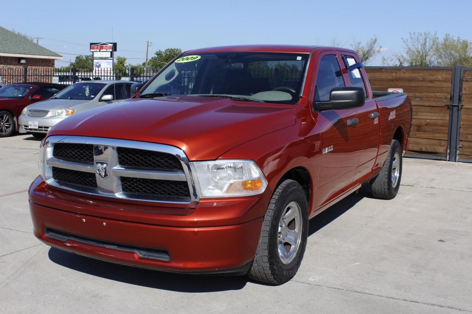 2009 Orange Dodge Ram 1500 SLT Quad Cab 2WD (1D3HB18P69S) with an 4.7L V8 SOHC 16V FFV engine, 5-Speed Automatic transmission, located at 2401 E Main St., Grand Prairie, TX, 75050, (972) 262-4440, 32.748981, -96.969643 - Photo#1