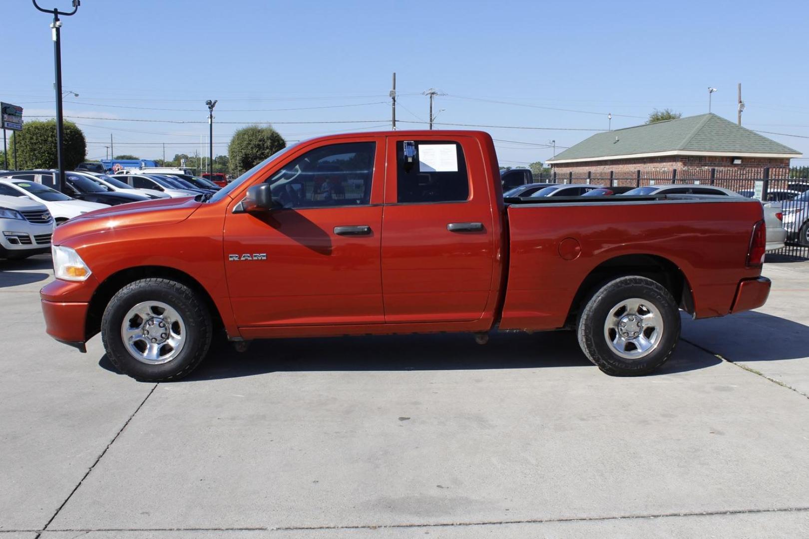 2009 Orange Dodge Ram 1500 SLT Quad Cab 2WD (1D3HB18P69S) with an 4.7L V8 SOHC 16V FFV engine, 5-Speed Automatic transmission, located at 2401 E Main St., Grand Prairie, TX, 75050, (972) 262-4440, 32.748981, -96.969643 - Photo#2