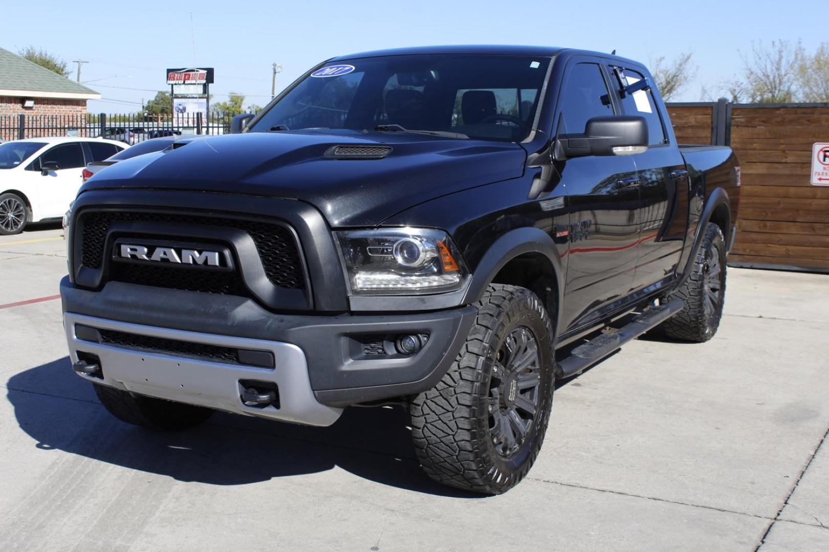 2017 black RAM 1500 Rebel Crew Cab SWB 4WD (1C6RR7YT0HS) with an 5.7L V8 OHV 16V engine, 8-Speed Automatic transmission, located at 2401 E Main St., Grand Prairie, TX, 75050, (972) 262-4440, 32.748981, -96.969643 - Photo#1