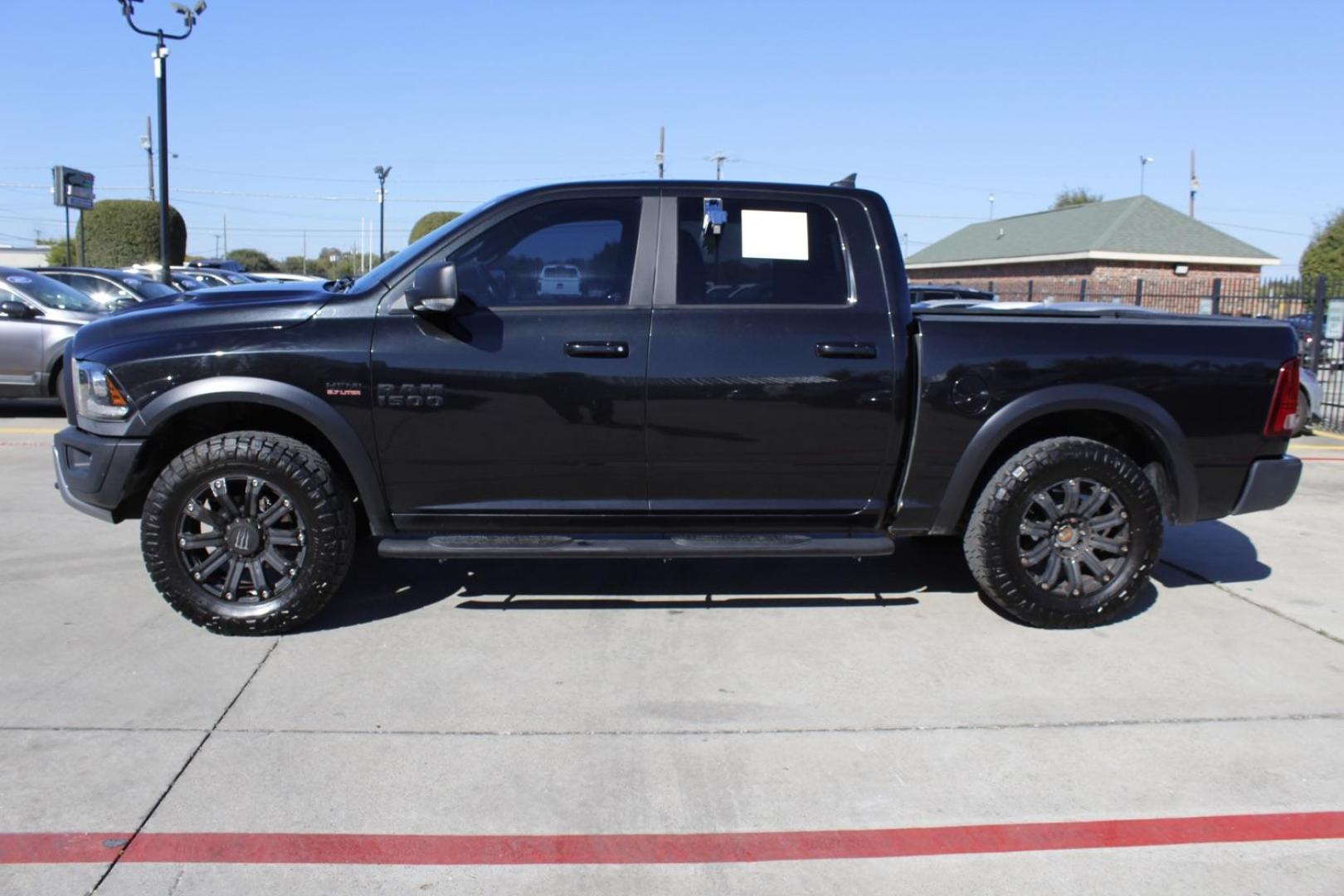 2017 black RAM 1500 Rebel Crew Cab SWB 4WD (1C6RR7YT0HS) with an 5.7L V8 OHV 16V engine, 8-Speed Automatic transmission, located at 2401 E Main St., Grand Prairie, TX, 75050, (972) 262-4440, 32.748981, -96.969643 - Photo#2