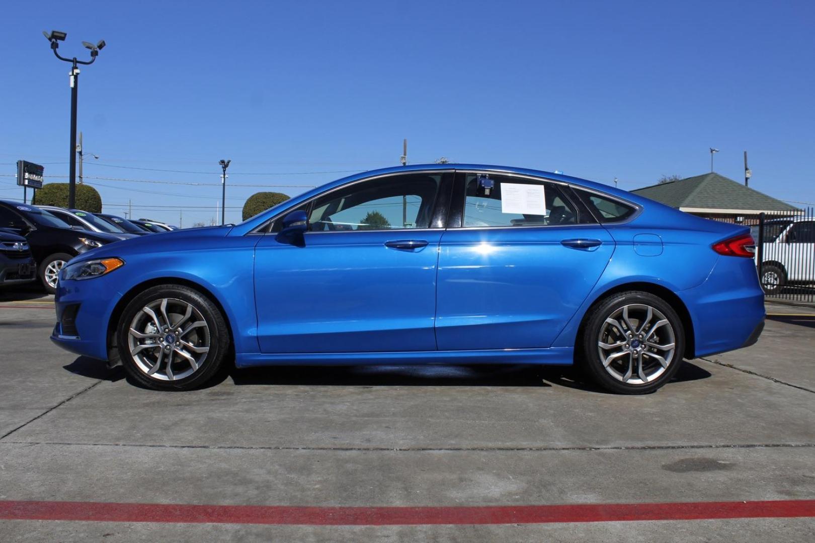 2019 blue Ford Fusion SEL (3FA6P0CD8KR) with an 1.5L L4 DOHC 16V engine, 6-Speed Automatic transmission, located at 2401 E Main St., Grand Prairie, TX, 75050, (972) 262-4440, 32.748981, -96.969643 - Photo#2