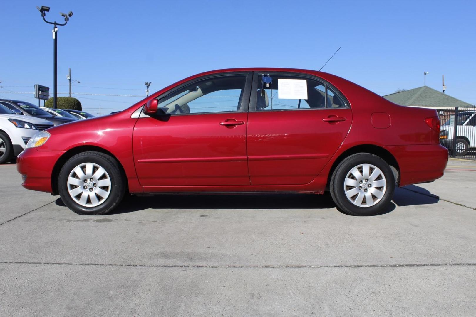 2004 red Toyota Corolla LE (1NXBR32E64Z) with an 1.8L L4 DOHC 16V engine, located at 2401 E Main St., Grand Prairie, TX, 75050, (972) 262-4440, 32.748981, -96.969643 - Photo#2