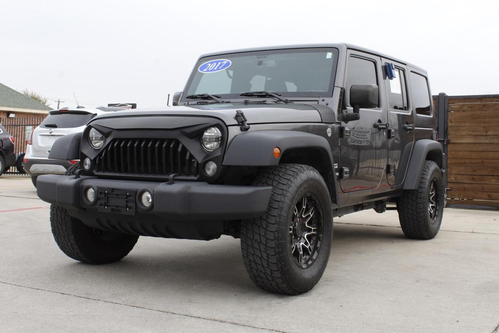 2017 Gray Jeep Wrangler Unlimited Sport 4WD (1C4BJWDG3HL) with an 3.6L V6 DOHC 24V FFV engine, located at 2401 E Main St., Grand Prairie, TX, 75050, (972) 262-4440, 32.748981, -96.969643 - Photo#1