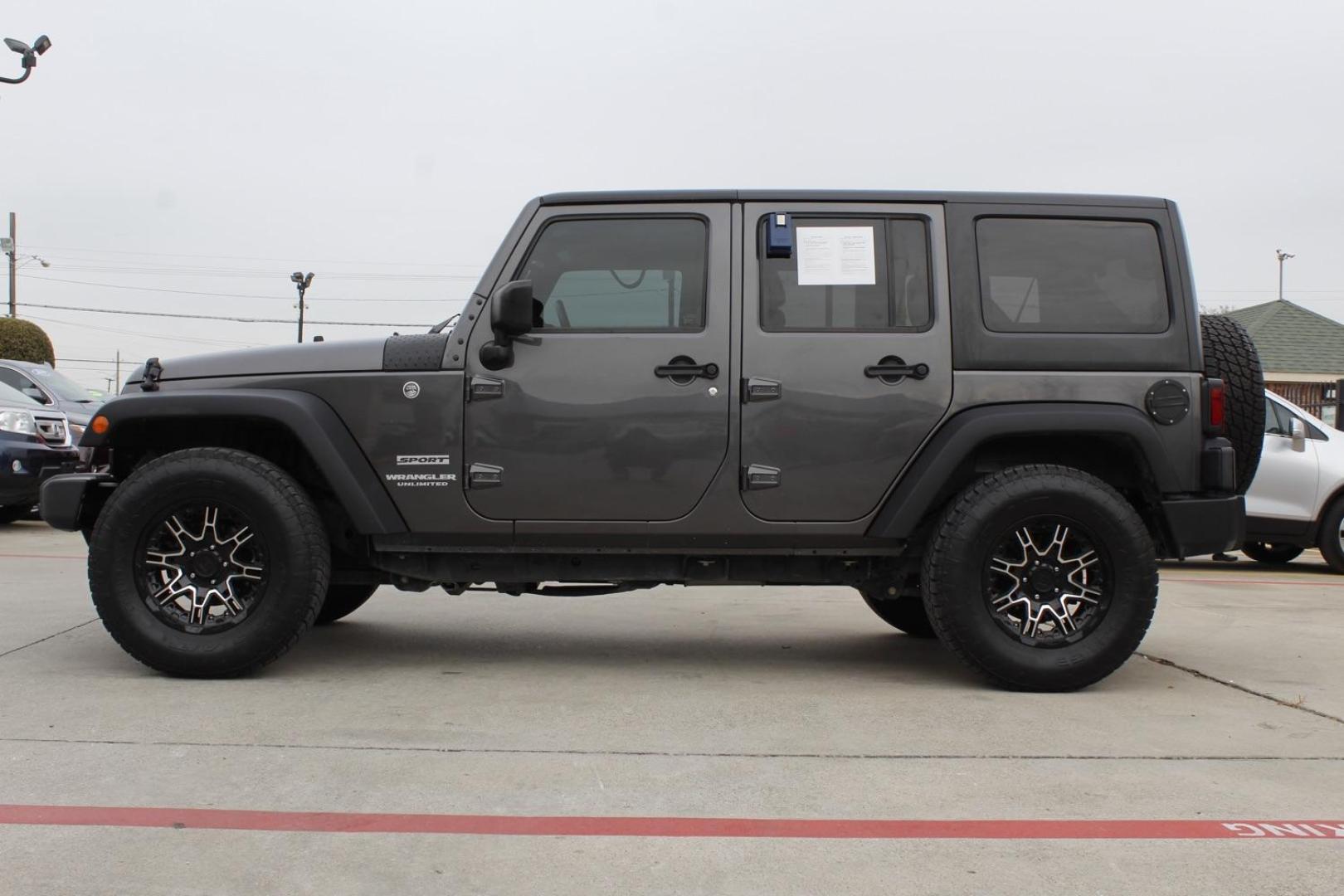 2017 Gray Jeep Wrangler Unlimited Sport 4WD (1C4BJWDG3HL) with an 3.6L V6 DOHC 24V FFV engine, located at 2401 E Main St., Grand Prairie, TX, 75050, (972) 262-4440, 32.748981, -96.969643 - Photo#2