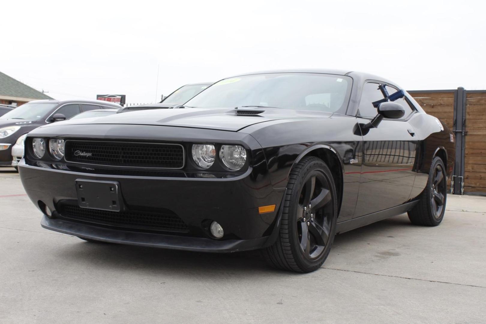 2014 Black Dodge Challenger SXT (2C3CDYAG8EH) with an 3.6L V6 DOHC 24V engine, 5-Speed Automatic transmission, located at 2401 E Main St., Grand Prairie, TX, 75050, (972) 262-4440, 32.748981, -96.969643 - Photo#1