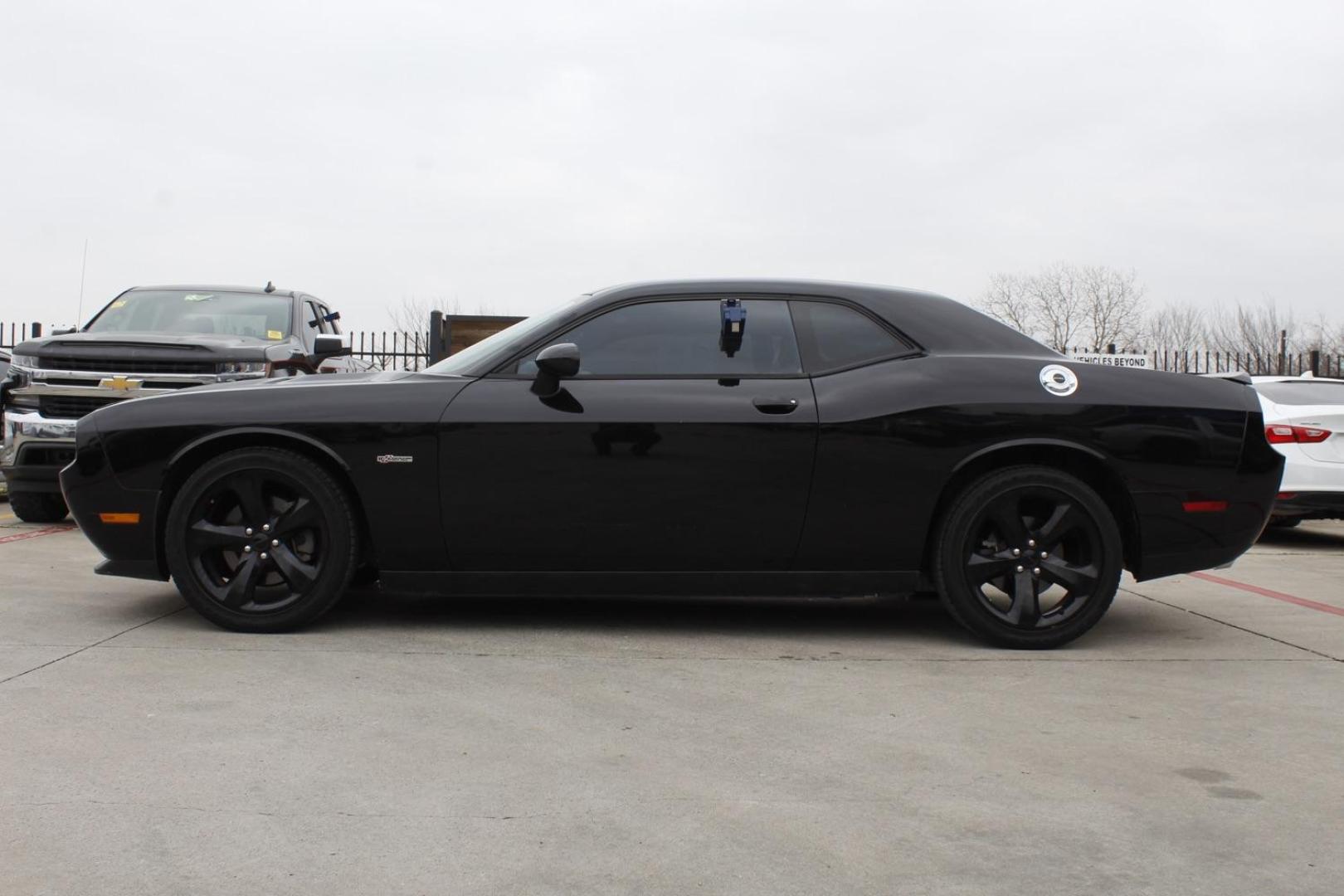 2014 Black Dodge Challenger SXT (2C3CDYAG8EH) with an 3.6L V6 DOHC 24V engine, 5-Speed Automatic transmission, located at 2401 E Main St., Grand Prairie, TX, 75050, (972) 262-4440, 32.748981, -96.969643 - Photo#2