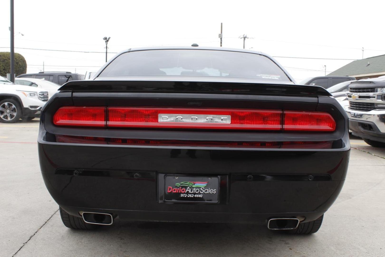 2014 Black Dodge Challenger SXT (2C3CDYAG8EH) with an 3.6L V6 DOHC 24V engine, 5-Speed Automatic transmission, located at 2401 E Main St., Grand Prairie, TX, 75050, (972) 262-4440, 32.748981, -96.969643 - Photo#5